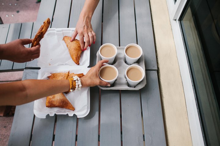 a person cooking food on a wooden cutting board
