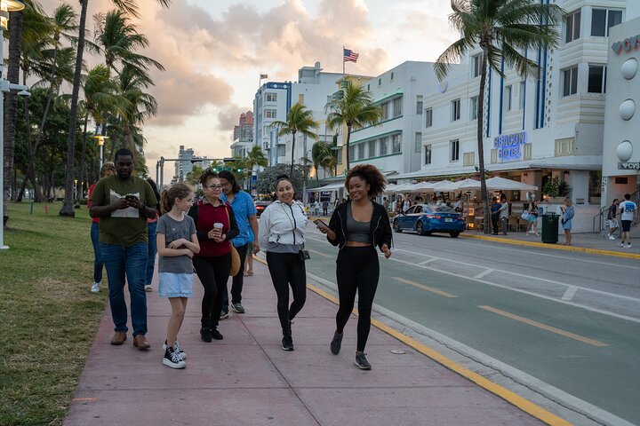 a group of people walking down the street