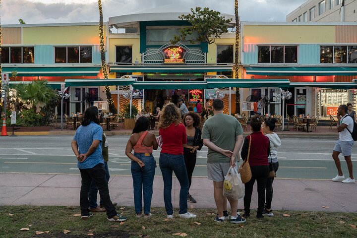 a group of people at a bus stop