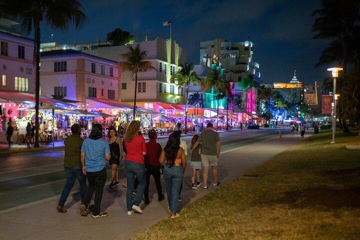 a group of people walking down the street