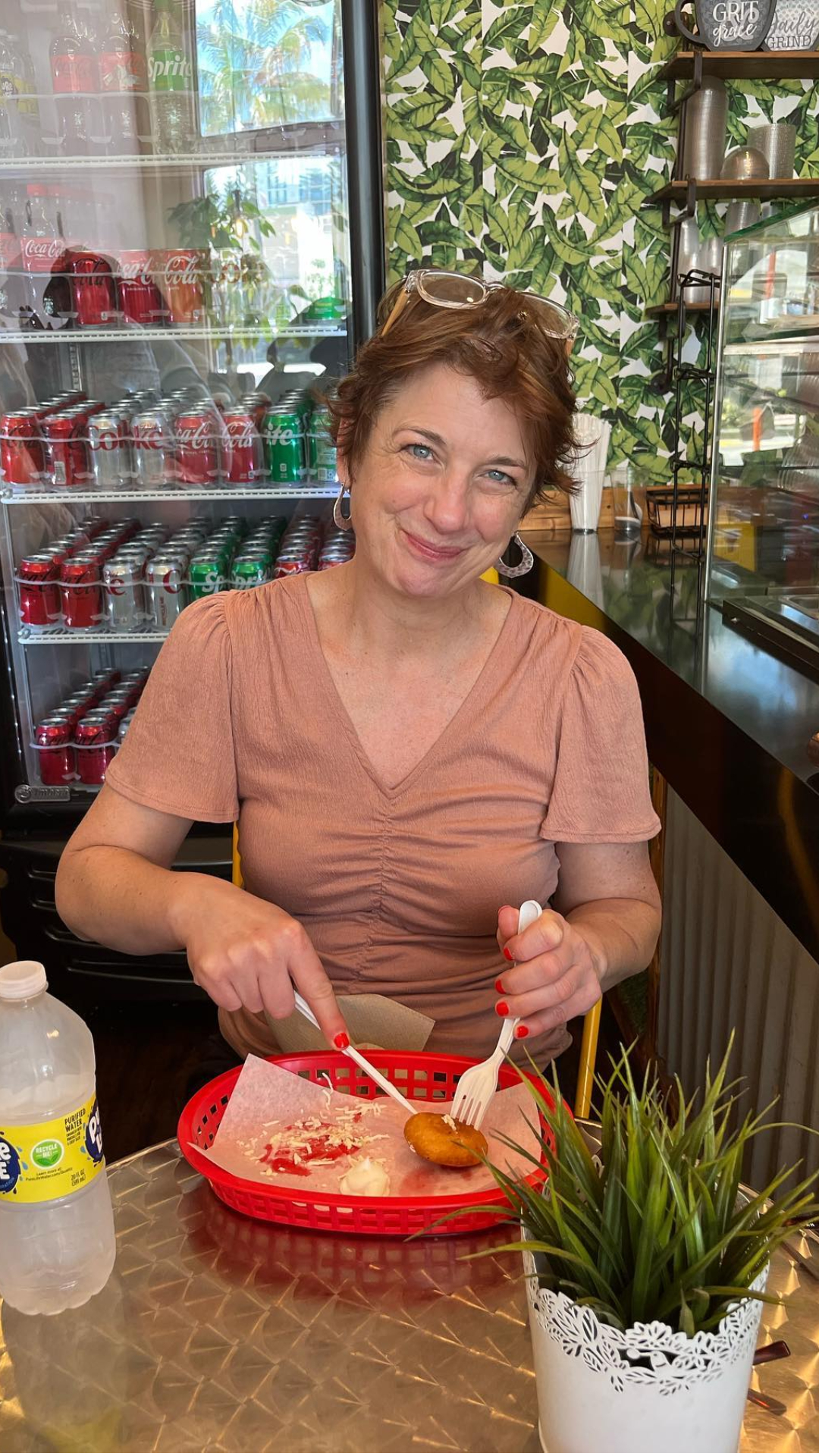 a person standing in front of a cake