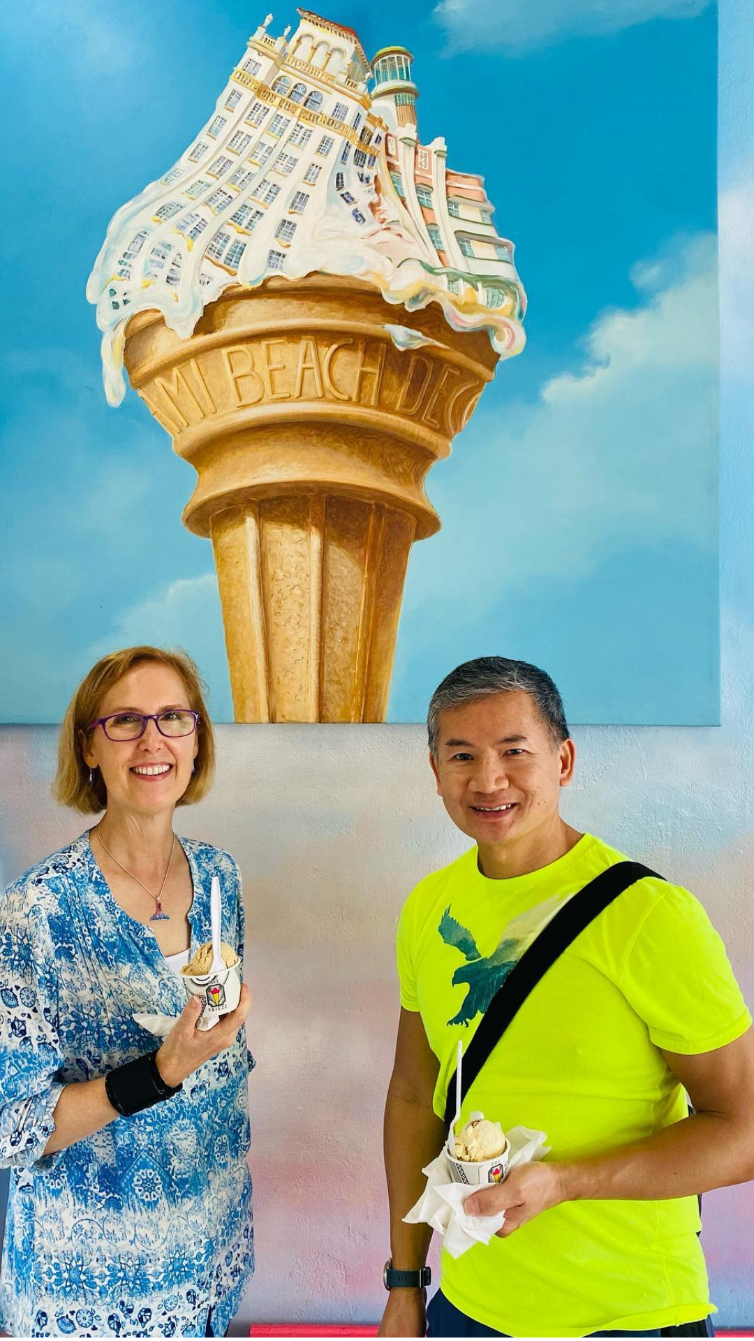 a man and a woman standing in front of a building