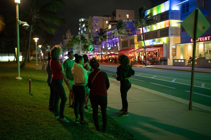 a group of people walking down a street