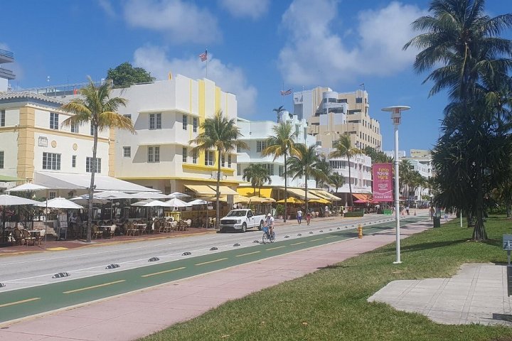 a group of people walking in front of a building