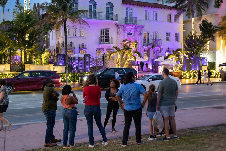 a group of people walking on a city street