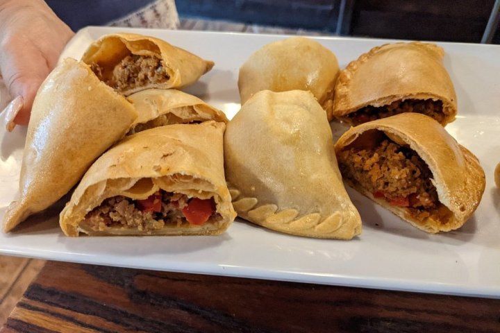 a cut in half sandwich sitting on top of a table