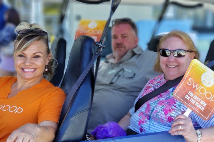 a group of people sitting on a bus